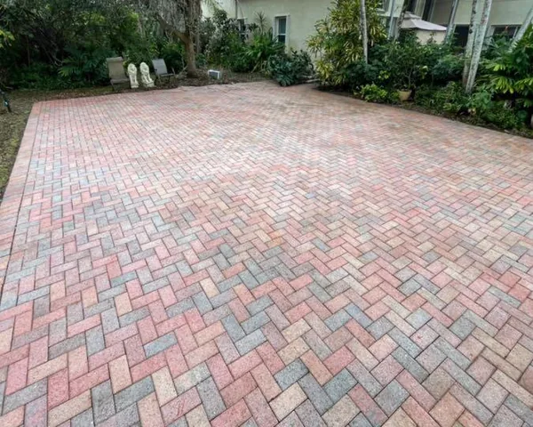 A herringbone paver driveway after cleaning