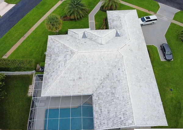 White tile roof before: grey and streaked