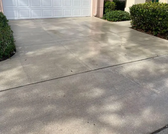 A concrete driveway after pressure washing