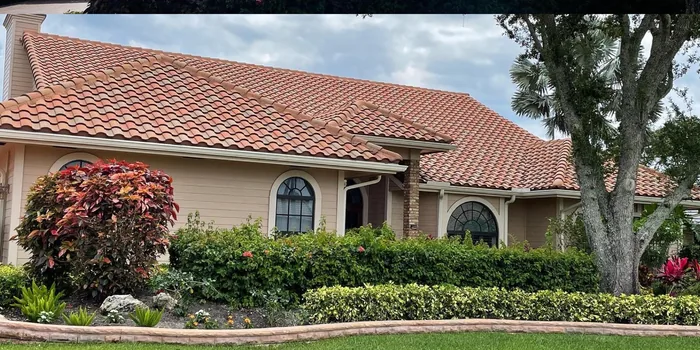 A home with a red tile roof after a wash