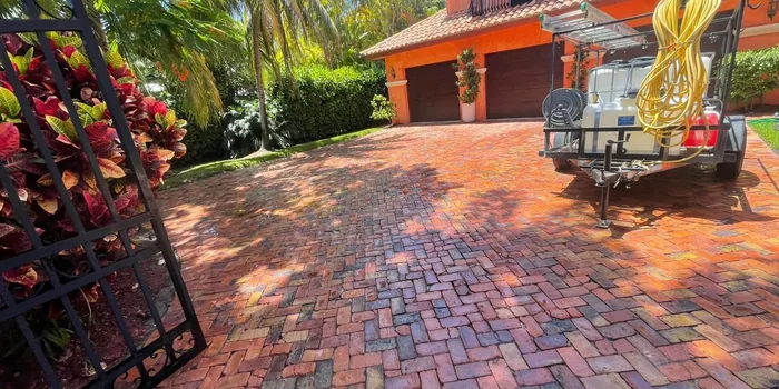 Red brick pavers glowing after cleaning, with the Supreme rig behind