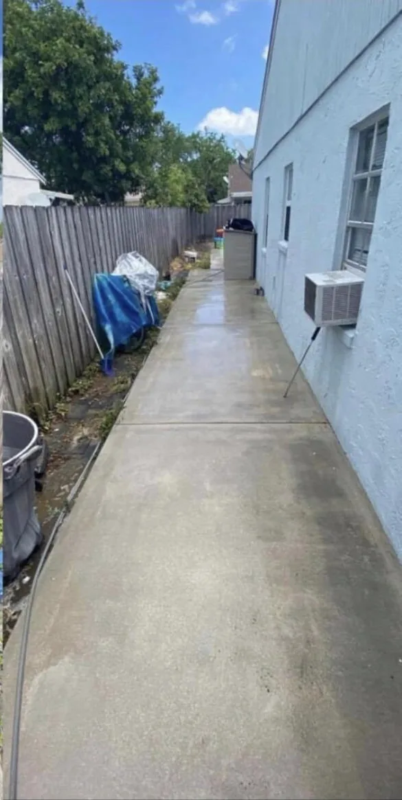 A long side walkway, clean and still wet